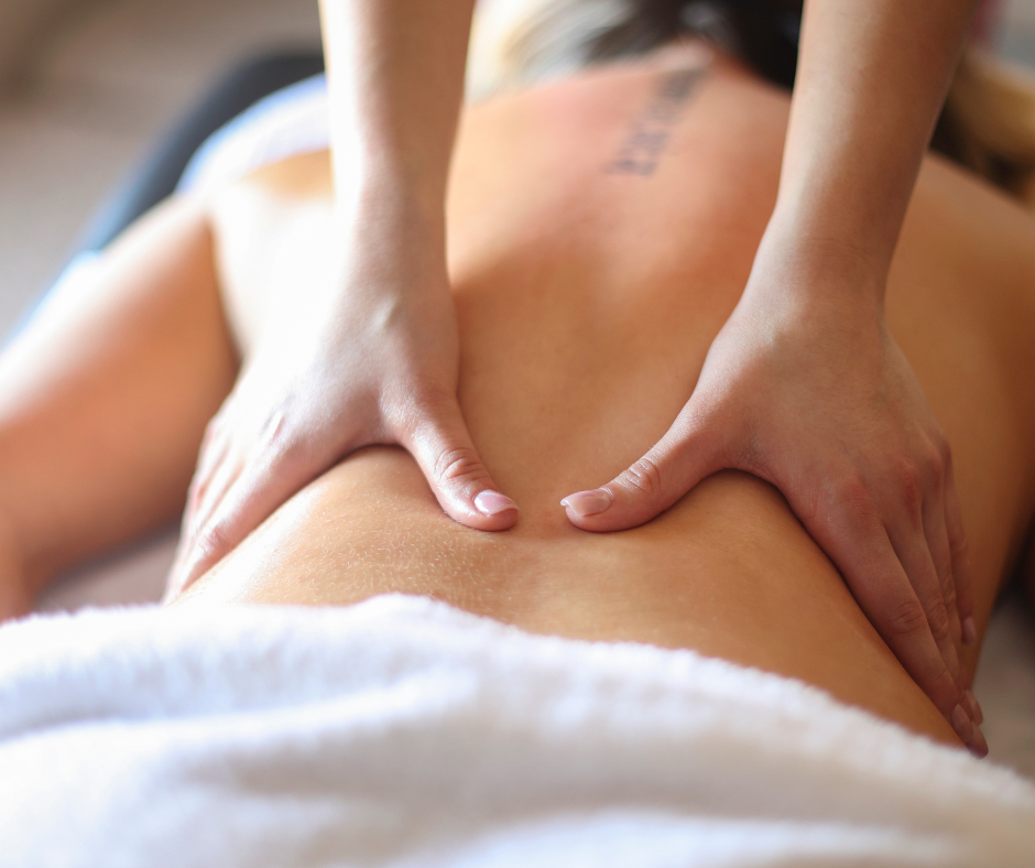 A Woman enjoying a relaxing back massage with essential oils at Victoria Spa