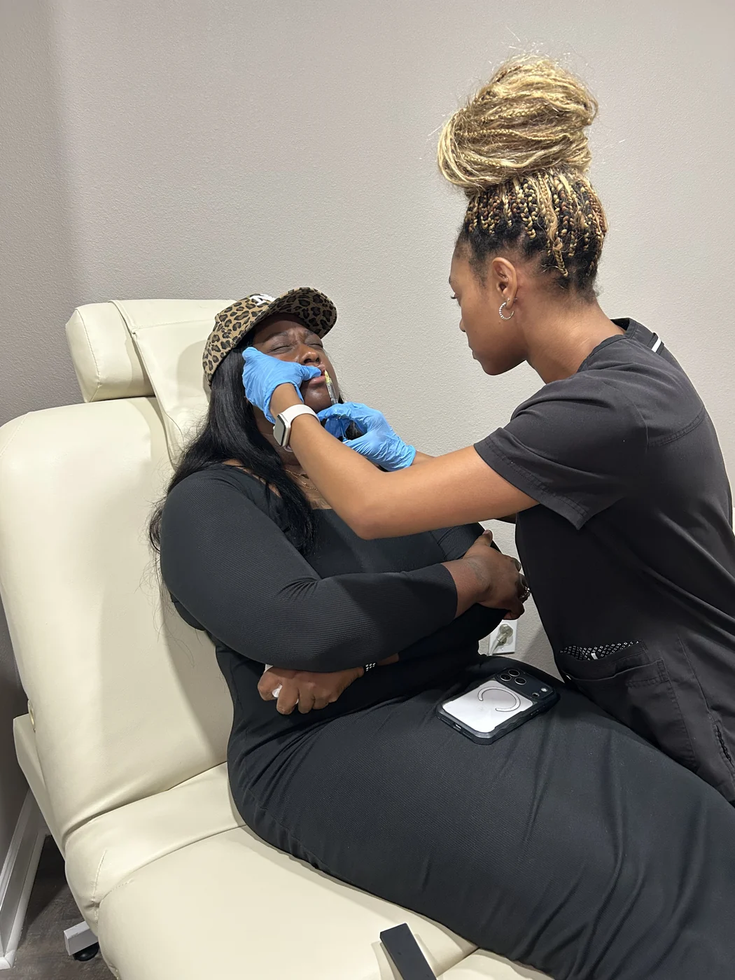 Aesthetic provider treating a client in the med spa treatment room at Victoria Edward Spa in Longwood, FL